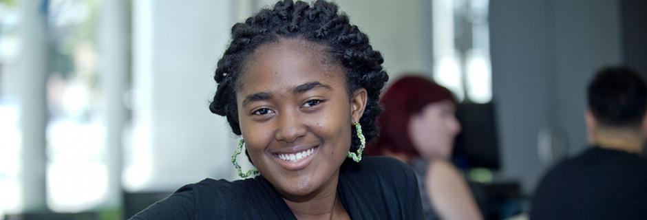 A student smiling at Community College of Philadelphia.
