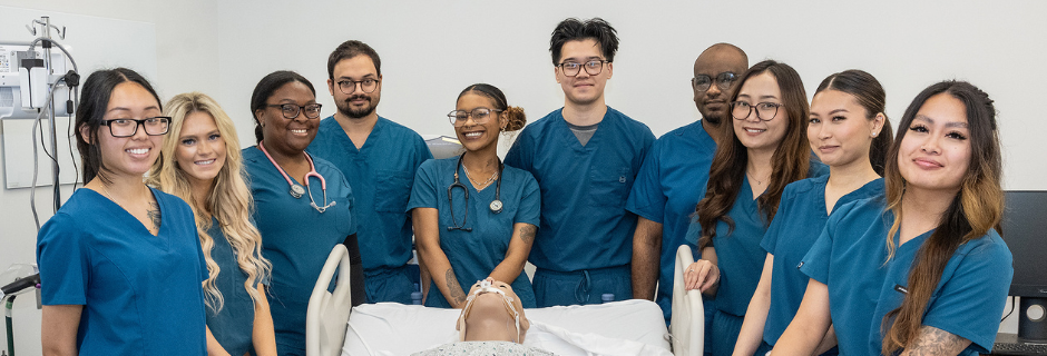 Resperatory students around a medical mannequin