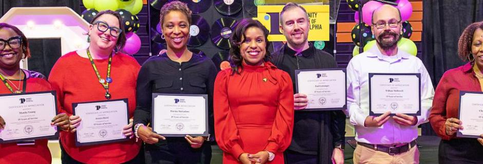 Dr. Marshall with employees accepting their years of service recognition Dr. Marshall with employees accepting their years of service recognition