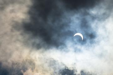 A view of the eclipse through the clouds.