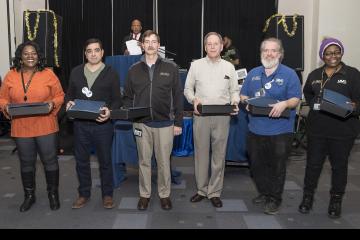 Employees with 30 years of service pose for the camera
