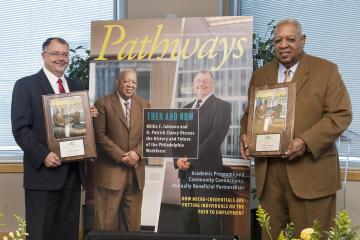 Patrick Clancy and Willie Johnson pose with Pathways Magazine covers