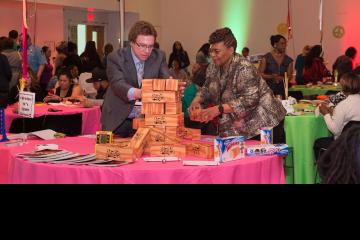 Vice Presidents Sam Hirsch and Lynette Brown-Sow play giant Jenga.