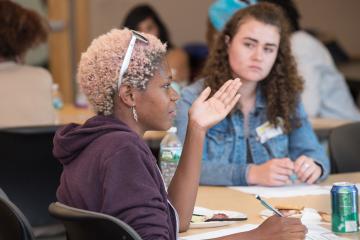A participant speaks during group discussion.