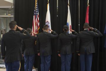 The Color Guard salutes the flags.