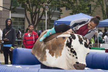 The rider slides off the Mechanical Bull.