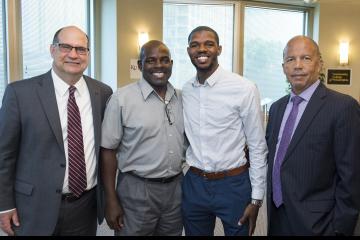 Fred Dukes IV poses with his father Fred Dukes III and both Presidents.