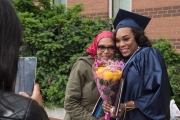 A graduate celebrates with her mother after the ceremony.