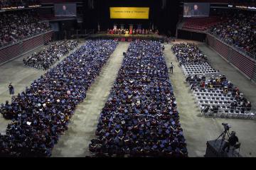 A shot of all the graduates from high up in the arena.