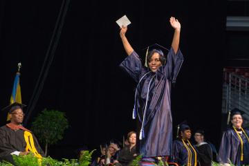 A graduate celebrates.