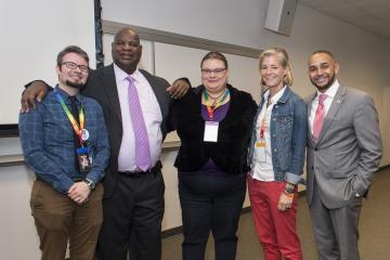 Some members of the LGBTQ conference planning committee and speaker Dante Austin pose for the camera.