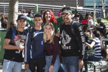 A group of students smile for the camera.