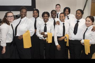 Hospitality Management Students, looking sharp, pose for the camera.