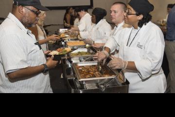 Culinary Arts students serving guests.