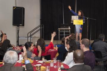 Keynote Speaker Debora Borges Carrera gets a show of hands from the crowd.