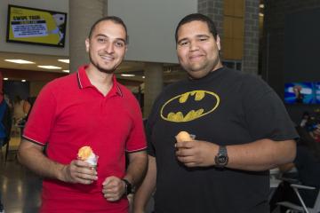 Two students pose with their water ice.